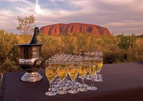 Champagne at sunset, an evening tradition, Uluru National Park, Australia