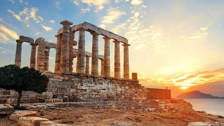 Sunset at at Temple of Poseidon near Athens. Photo Credit: Songquan Deng/Shutterstock.com