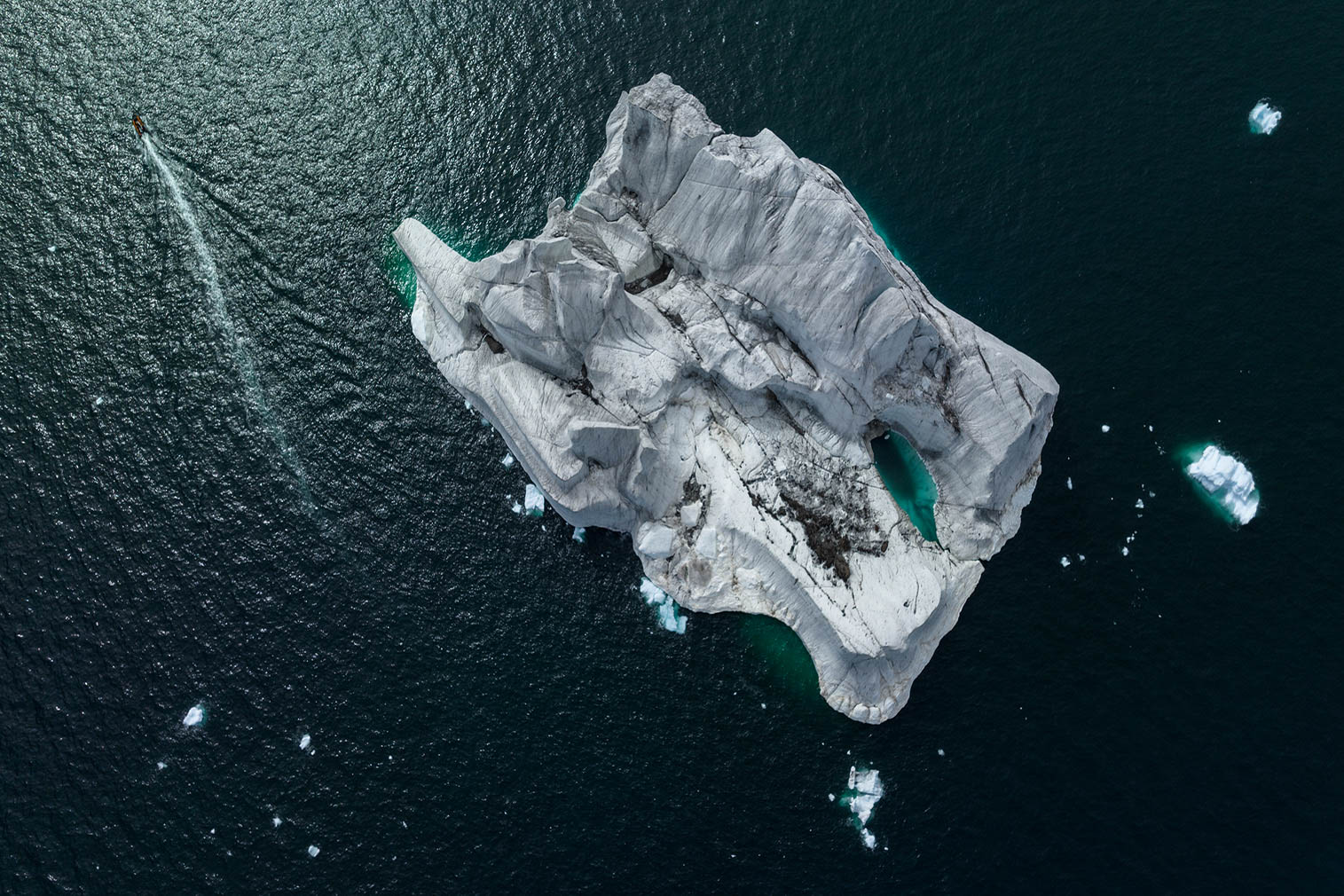 Snow Hill Aerial shot of iceberg with zodiac Coulson and Tennant