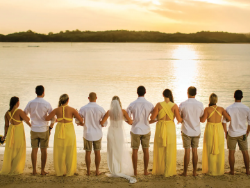 people on a beach looking at water