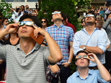 People looking at the solar eclipse