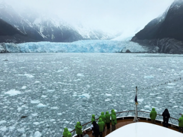 Atlas crusie lines in front of a glacier