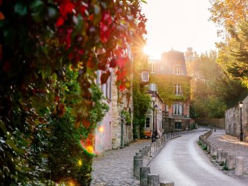 Empty coastal harbor in a quiet Northern European town under soft overcast April light, reflecting the calm atmosphere of shoulder season travel.