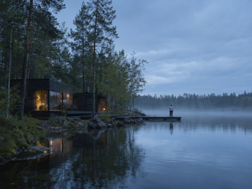 Contemporary timber retreat beside a misty Nordic lake during a luminous northern summer evening.